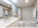 Bright bathroom featuring a single sink vanity, a bathtub and shower, and nautical decorations at 1275 Ocean Shore Blvd # 5050, Ormond Beach, FL 32176