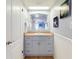 Vanity with a sink, mirror, and tiled floor at 1275 Ocean Shore Blvd # 5050, Ormond Beach, FL 32176