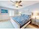 Cozy bedroom with coastal decor, ceiling fan, and ample natural light at 1275 Ocean Shore Blvd # 5050, Ormond Beach, FL 32176