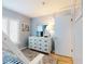 Bunk bed bedroom featuring a dresser with a TV and plantation shutters at 1275 Ocean Shore Blvd # 5050, Ormond Beach, FL 32176