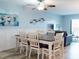Eat-in kitchen with a wooden table and upholstered chairs at 1275 Ocean Shore Blvd # 5050, Ormond Beach, FL 32176