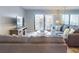 Cozy living room with balcony access, stylish furnishings, and a large flatscreen television at 1275 Ocean Shore Blvd # 5050, Ormond Beach, FL 32176