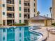 Gorgeous swimming pool area with an outdoor kitchen cabana and plenty of seating for entertaining at 1275 Ocean Shore Blvd # 5050, Ormond Beach, FL 32176