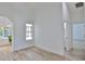Bright bedroom featuring wood-look tile flooring, a window, and light neutral walls at 1350 Scarlett Trl, New Smyrna Beach, FL 32168