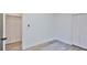 Bedroom featuring wood-look tile floors, a closet, and light neutral walls at 1350 Scarlett Trl, New Smyrna Beach, FL 32168