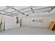 Spacious garage with ample storage space and ladder at 1350 Scarlett Trl, New Smyrna Beach, FL 32168