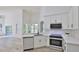 Contemporary kitchen with stainless steel appliances and white cabinets offers ample space at 1350 Scarlett Trl, New Smyrna Beach, FL 32168
