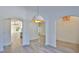 Bright living room with tile floors, arched doorways, white walls, and multiple rooms visible at 1350 Scarlett Trl, New Smyrna Beach, FL 32168