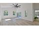Bright living room with windows offering ample natural light and outdoor views at 1350 Scarlett Trl, New Smyrna Beach, FL 32168