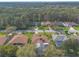A peaceful neighborhood with mature trees and lawns surrounding comfortable single Gathering homes at 15 Katrinas Dr, Ormond Beach, FL 32174