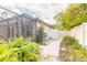 Backyard showing screened-in patio, walkway, and greenery at 15 Katrinas Dr, Ormond Beach, FL 32174