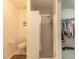 Bright bathroom with a shower stall and a glimpse into the walk-in closet at 15 Katrinas Dr, Ormond Beach, FL 32174