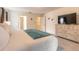 Bedroom with carpet, queen bed, ceiling fan, a dresser, and access to the bathroom and closet at 15 Katrinas Dr, Ormond Beach, FL 32174