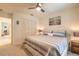 Bedroom with carpet, bed, ceiling fan, closet, and blue and white striped comforter at 15 Katrinas Dr, Ormond Beach, FL 32174