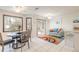 Bright breakfast nook with a colorful rug and sliding glass doors to the patio at 15 Katrinas Dr, Ormond Beach, FL 32174