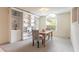 Bright dining area with an abundance of natural light, built in shelving and neutral carpeting at 15 Katrinas Dr, Ormond Beach, FL 32174