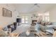 Bright living room features a fireplace, French doors to the pool, and comfortable seating at 15 Katrinas Dr, Ormond Beach, FL 32174