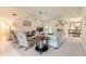 Comfortable living room featuring bright walls, natural lighting, and a ceiling fan for relaxing days at 15 Katrinas Dr, Ormond Beach, FL 32174