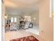 Bright living room with a fireplace, ceiling fan, and neutral walls perfect for relaxation and comfort at 15 Katrinas Dr, Ormond Beach, FL 32174