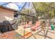 Spacious patio featuring lounge chairs, a grill, and a view of the lush backyard at 15 Katrinas Dr, Ormond Beach, FL 32174