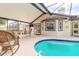 Relaxing screened-in patio with dining area and a view of the beautiful pool at 15 Katrinas Dr, Ormond Beach, FL 32174