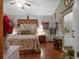 Cozy bedroom featuring unique decor, a ceiling fan, and warm, inviting ambiance at 1715 Fern Park Dr, Port Orange, FL 32128