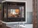 Bathroom with a cozy fireplace providing warmth and ambiance next to the soaking tub at 1715 Fern Park Dr, Port Orange, FL 32128