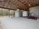 Spacious garage featuring high ceilings, parking, and ample storage at 1715 Fern Park Dr, Port Orange, FL 32128