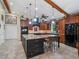 Well-equipped kitchen boasts custom cabinets, granite countertops, and a functional center island with seating at 1715 Fern Park Dr, Port Orange, FL 32128