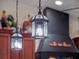 Close-up of the kitchen lighting fixtures and decorative range hood, highlighting the attention to detail at 1715 Fern Park Dr, Port Orange, FL 32128