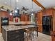 Elegant kitchen featuring custom cabinetry, granite countertops, and a large center island with seating at 1715 Fern Park Dr, Port Orange, FL 32128