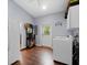 Spacious laundry room with modern appliances, ample storage, and a convenient exterior door at 1715 Fern Park Dr, Port Orange, FL 32128
