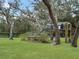 A beautiful observation deck surrounded by lush greenery and mature oak trees at 1715 Fern Park Dr, Port Orange, FL 32128