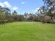 Expansive green pasture enclosed by dark fencing, offering ample space for livestock to roam freely and graze at 1715 Fern Park Dr, Port Orange, FL 32128