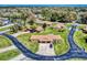 Aerial view of a community showcasing manicured lawns and neat landscaping and driveways at 1818 Enterprise Ave # B, New Smyrna Beach, FL 32168