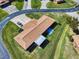 Aerial view of home with a patio and well maintained landscaping and lawn at 1818 Enterprise Ave # B, New Smyrna Beach, FL 32168