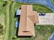 Aerial view showcasing a home with an extended patio, long driveway, and backyard oasis in a peaceful community at 1818 Enterprise Ave # B, New Smyrna Beach, FL 32168