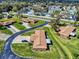 Aerial view of a single-Gathering home showcasing its manicured lawn and neighborhood at 1818 Enterprise Ave # B, New Smyrna Beach, FL 32168