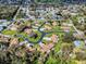 Wide shot of a well-maintained community with winding roads and verdant lawns at 1818 Enterprise Ave # B, New Smyrna Beach, FL 32168