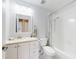 Bathroom featuring a vanity with marble countertop and a shower over bath at 1818 Enterprise Ave # B, New Smyrna Beach, FL 32168