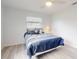 A charming bedroom with a plush bed, bright natural light, and soothing ambiance at 1818 Enterprise Ave # B, New Smyrna Beach, FL 32168