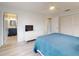 Bright bedroom featuring a ceiling fan, ensuite bathroom, and spacious closet for ample storage at 1818 Enterprise Ave # B, New Smyrna Beach, FL 32168