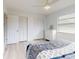 Bright bedroom featuring white walls, wood-look flooring and ample closet space at 1818 Enterprise Ave # B, New Smyrna Beach, FL 32168