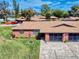 Charming brick home with a well-maintained lawn and inviting landscaping details at 1818 Enterprise Ave # B, New Smyrna Beach, FL 32168