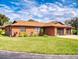 Charming home with a well-manicured lawn, brick exterior, and double garage at 1818 Enterprise Ave # B, New Smyrna Beach, FL 32168