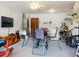 Garage with a laundry machine, table and mounted TV at 1818 Enterprise Ave # B, New Smyrna Beach, FL 32168