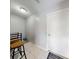 Hallway with white tile flooring and seating at 1818 Enterprise Ave # B, New Smyrna Beach, FL 32168