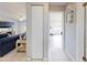 Inviting hallway with tile flooring, leading to a bright living space and bedroom at 1818 Enterprise Ave # B, New Smyrna Beach, FL 32168