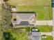 Drone's eye view highlighting roof with solar panels, boat parking, and backyard shed at 1880 1St Ave, Deland, FL 32724