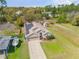 Aerial view of home featuring well maintained landscaping, solar panels, and a two car garage at 1880 1St Ave, Deland, FL 32724